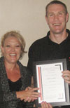 Malcolm Heathfield receives the SAIMC presenters certificate from Debbie Scott